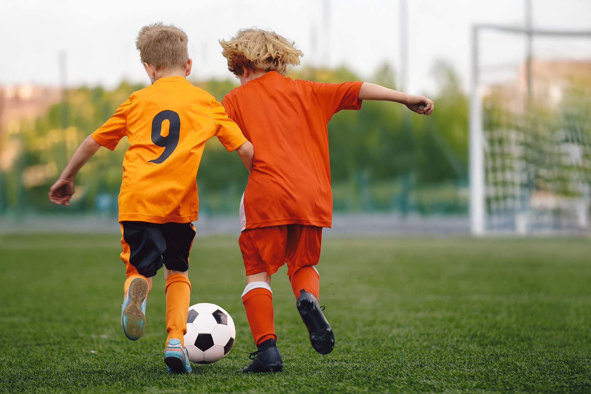 two kids playing football